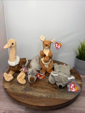Set of 4 Zoo themed Ty Beanie Babies - (Stretch,Spike,Pouch, & Mel)